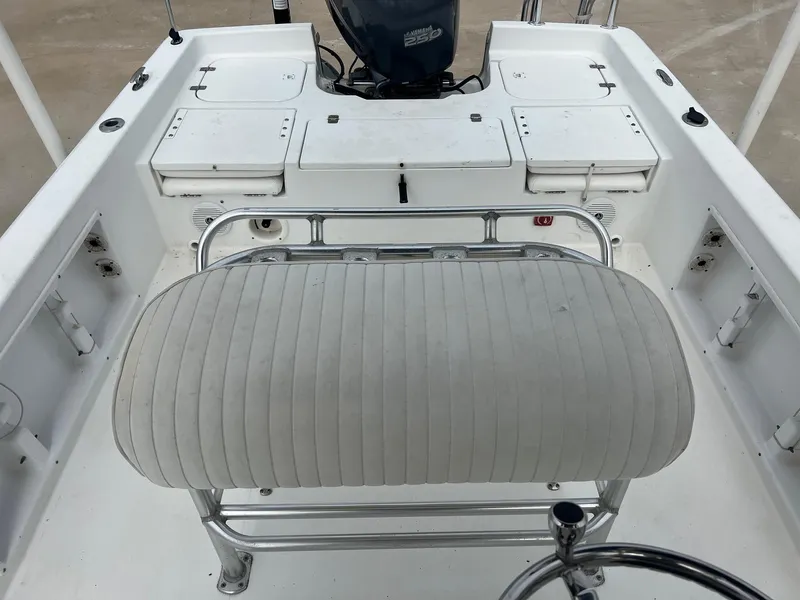 Slide: The Image of 2009 Sea Hunt BX24 boat interior with seating and storage compartments. - 26