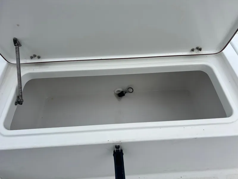 Slide: The Image of Open storage compartment on a 2009 Sea Hunt BX24 boat. - 33