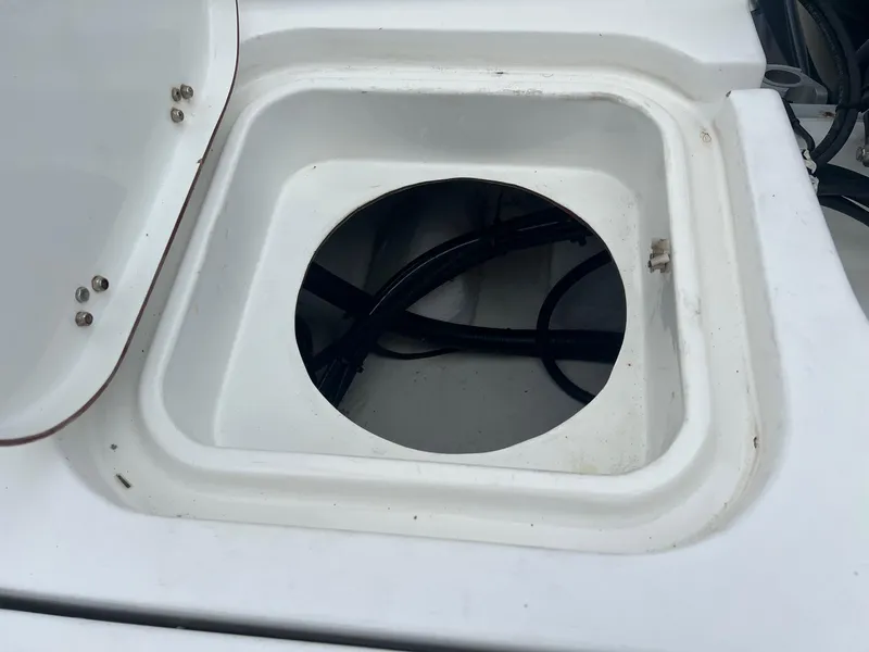 Slide: The Image of Open hatch on 2009 Sea Hunt BX24 boat, revealing internal wiring. - 35