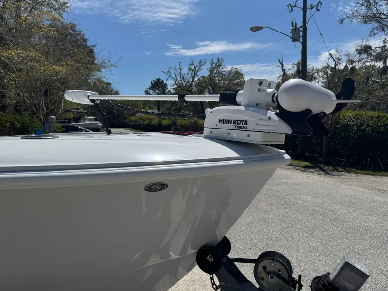 Slide: The Image of 2015 Contender 24 Sport boat with Minn Kota trolling motor on trailer. - 17