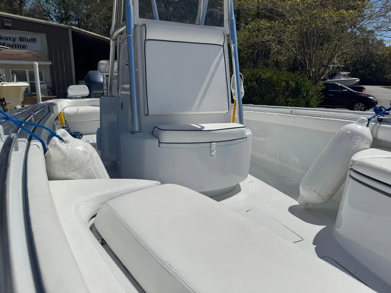 Slide: The Image of 2015 Contender 24 Sport boat interior with white seating and console. - 19