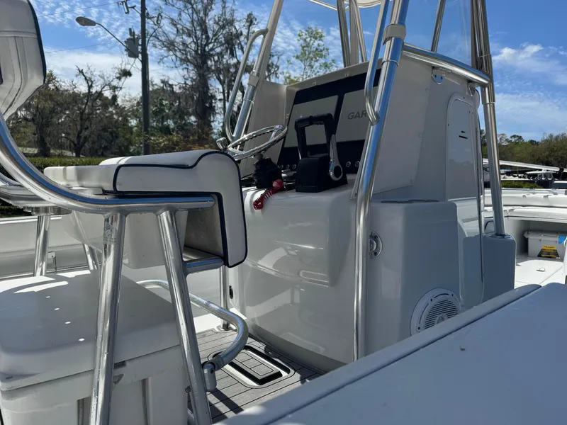 Slide: The Image of 2015 Contender 24 Sport boat interior with seating and control panel. - 22