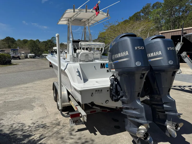 Slide: The Image of 2015 Contender 24 Sport boat with twin Yamaha 150 engines on a trailer. - 5