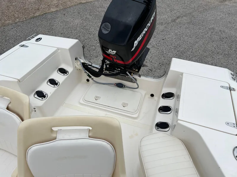 Slide: The Image of 2000 Sea Pro 180 Center Console boat with outboard motor and seating. - 11