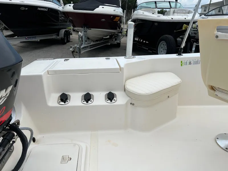 Slide: The Image of 2000 Sea Pro 180 Center Console boat interior with seating and motor view. - 4