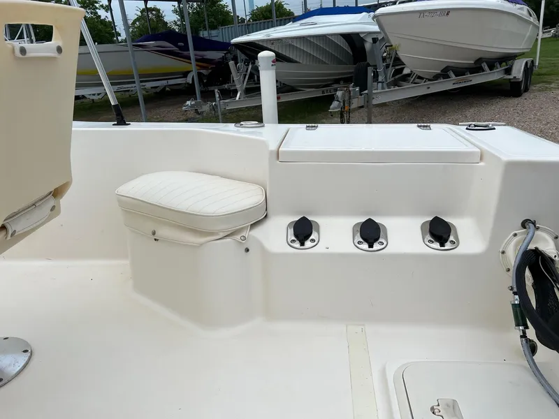 Slide: The Image of 2000 Sea Pro 180 Center Console boat interior with seating and storage compartments. - 5