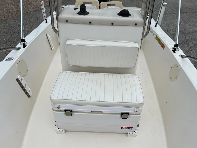 Slide: The Image of 2000 Sea Pro 180 Center Console boat interior with white seating and console. - 9