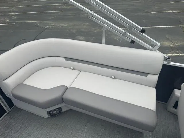 Slide: The Image of Luxurious seating on 2023 Godfrey Sweetwater 2286 SBX Tritoon boat, featuring plush gray upholstery. - 12