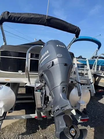 Slide: The Image of 2023 Godfrey Sweetwater 2286 SBX Tritoon with 150 Yamaha engine, docked outdoors. - 15
