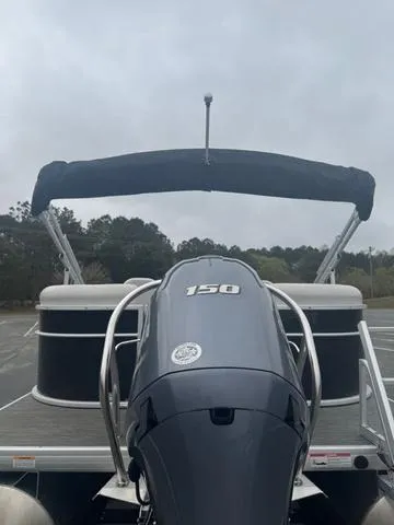 Slide: The Image of 2023 Godfrey Sweetwater 2286 SBX Tritoon with 150 Yamaha engine, parked outdoors. - 3