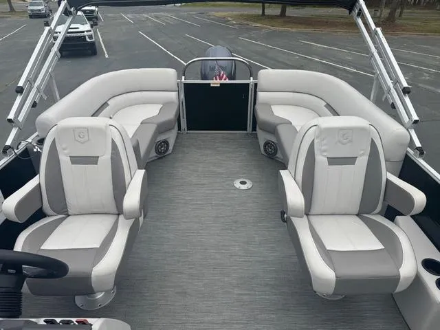 Slide: The Image of 2023 Godfrey Sweetwater 2286 SBX Tritoon interior with plush seating and modern design. - 4