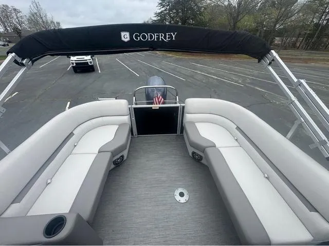 Slide: The Image of 2023 Godfrey Sweetwater 2286 SBX Tritoon with Yamaha 150, featuring spacious seating and canopy. - 6