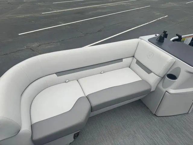 Slide: The Image of 2023 Godfrey Sweetwater 2286 SBX Tritoon with 150 Yamaha engine, parked outdoors. - 9