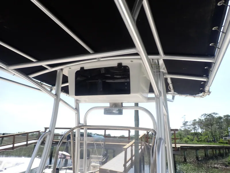 Slide: The Image of 2014 Robalo R200 Center Console boat with T-top and console view. - 12