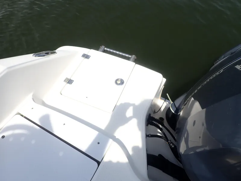 Slide: The Image of 2014 Robalo R200 Center Console boat stern with engine, on calm water. - 19