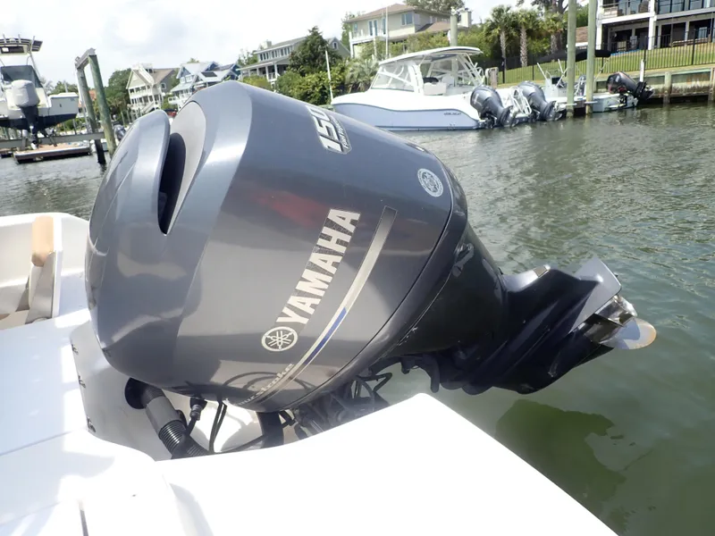 Slide: The Image of 2014 Robalo R200 Center Console with Yamaha outboard engine docked in marina. - 21