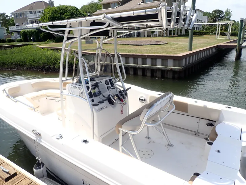 Slide: The Image of 2014 Robalo R200 Center Console boat docked by waterfront homes. - 28
