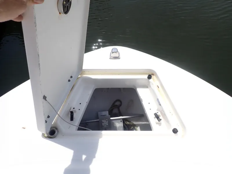 Slide: The Image of 2014 Robalo R200 Center Console boat with open storage compartment on deck. - 8