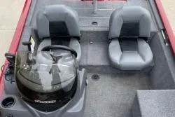 Slide: The Image of 2024 Tracker Pro 170 boat interior with two gray seats and steering console. - 3