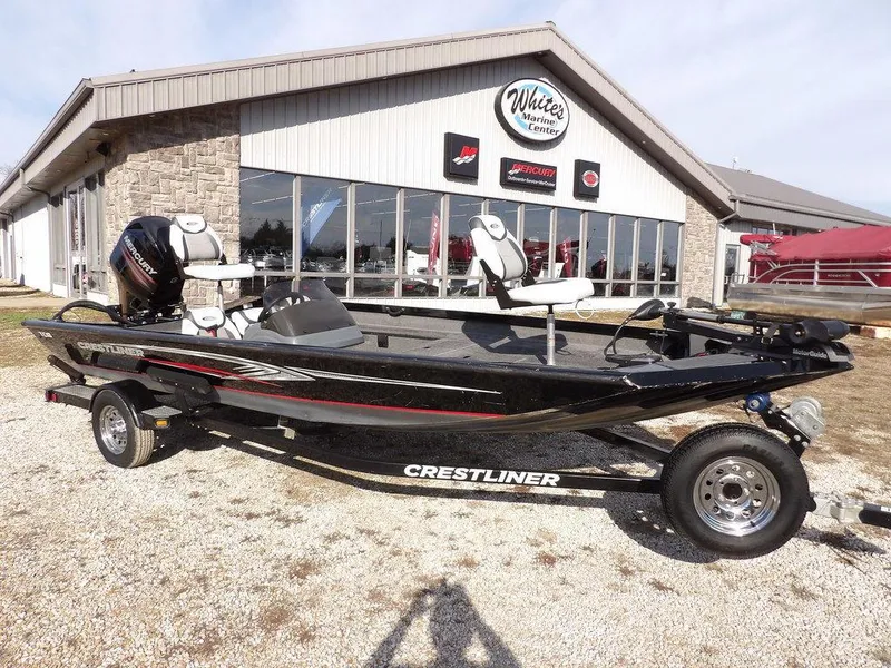 Slide: The Image of 2013 Crestliner TC Series 18 boat on trailer outside dealership. - 1
