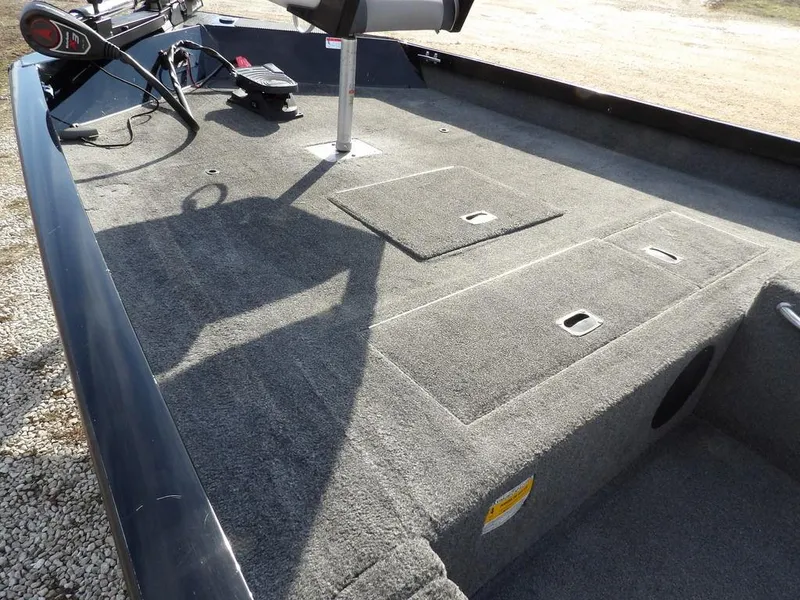 Slide: The Image of 2013 Crestliner TC Series 18 boat interior with carpeted deck and seating. - 10