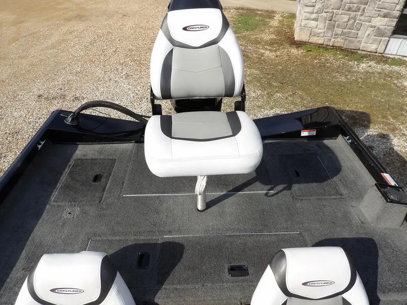 Slide: The Image of 2013 Crestliner TC Series 18 boat interior with gray and white seating. - 11