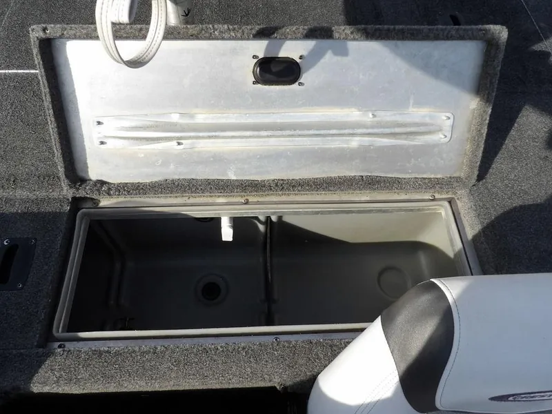 Slide: The Image of Open storage compartment in 2013 Crestliner TC Series 18 boat. - 14