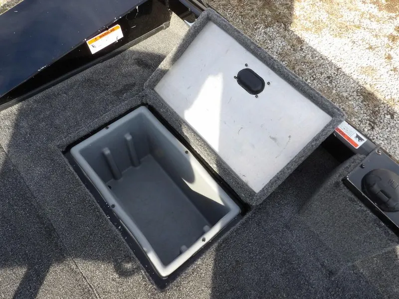 Slide: The Image of Open storage compartment in 2013 Crestliner TC Series 18 boat. - 15