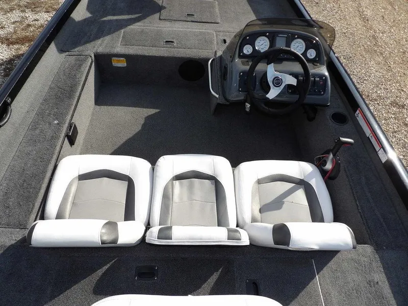Slide: The Image of 2013 Crestliner TC Series 18 boat interior with three seats and steering console. - 16