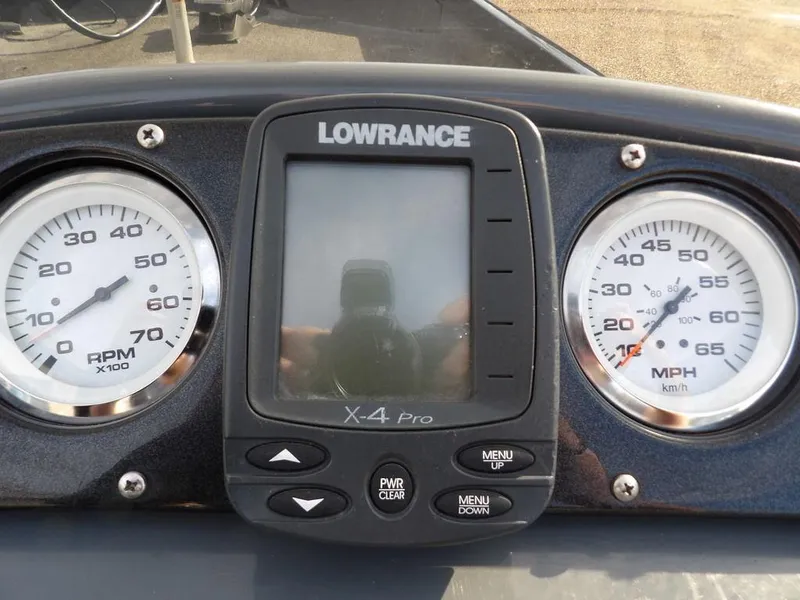 Slide: The Image of Dashboard of 2013 Crestliner TC Series 18 with Lowrance X-4 Pro and gauges. - 19