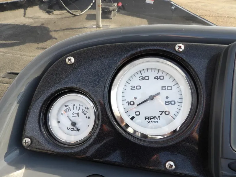 Slide: The Image of Dashboard gauges of 2013 Crestliner TC Series 18 boat, showing RPM and voltage. - 20