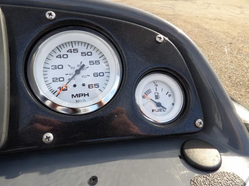 Slide: The Image of Dashboard of 2013 Crestliner TC Series 18 with speedometer and fuel gauge. - 21