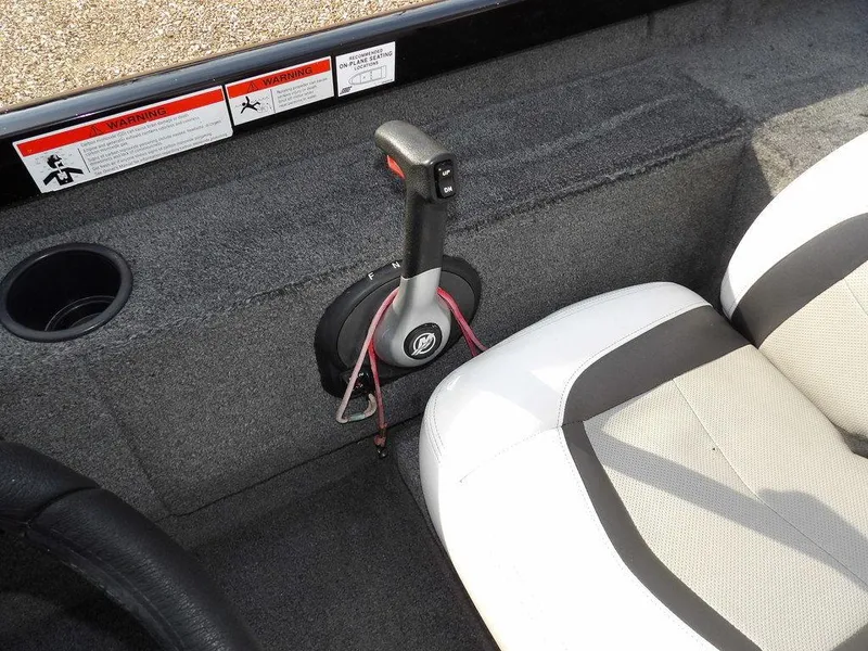 Slide: The Image of 2013 Crestliner TC Series 18 boat interior with throttle control and seating. - 22