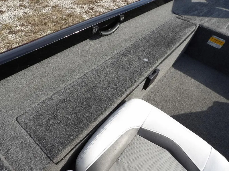 Slide: The Image of 2013 Crestliner TC Series 18 boat interior with gray carpet and seating. - 24