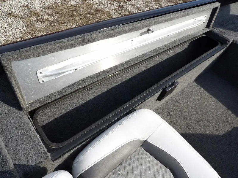 Slide: The Image of 2013 Crestliner TC Series 18 boat interior with open storage compartment and seating. - 25