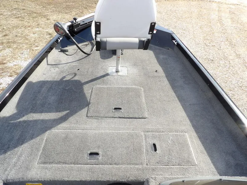 Slide: The Image of 2013 Crestliner TC Series 18 boat interior with gray carpet and swivel seat. - 27