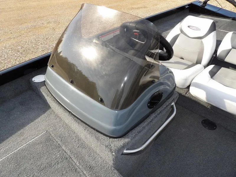 Slide: The Image of 2013 Crestliner TC Series 18 boat console with windshield and seating. - 28