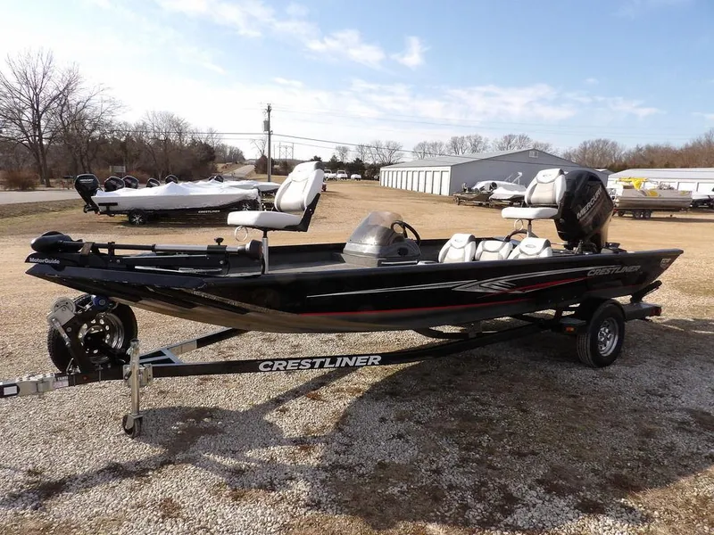 Slide: The Image of 2013 Crestliner TC Series 18 boat on trailer in outdoor setting. - 3