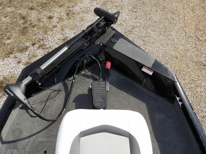 Slide: The Image of 2013 Crestliner TC Series 18 boat interior with trolling motor and seat. - 32