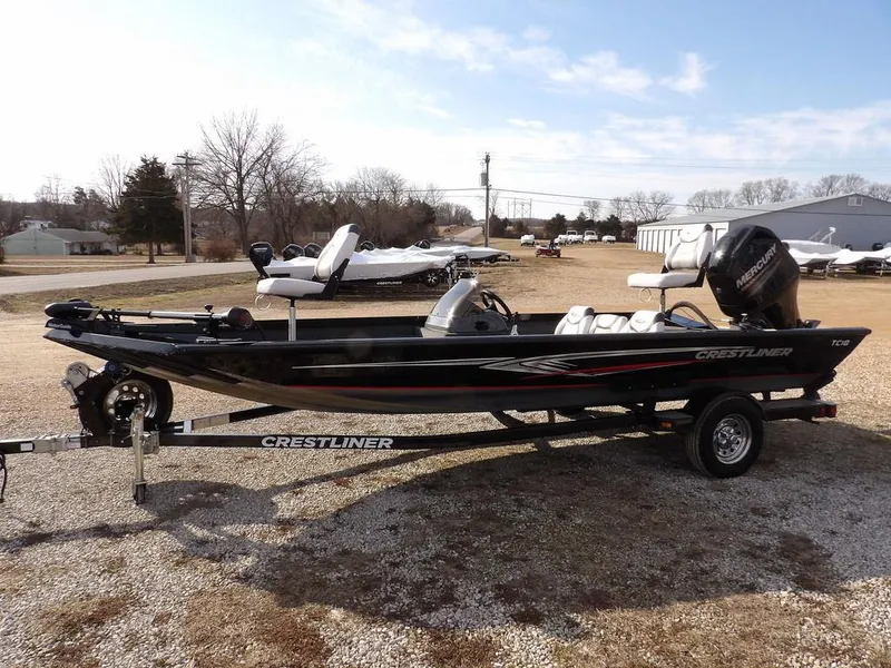 Slide: The Image of 2013 Crestliner TC Series 18 boat on trailer, parked outdoors. - 4