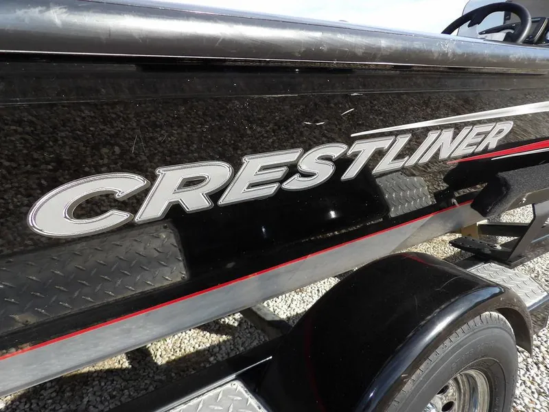 Slide: The Image of 2013 Crestliner TC Series 18 boat with black exterior and logo. - 41