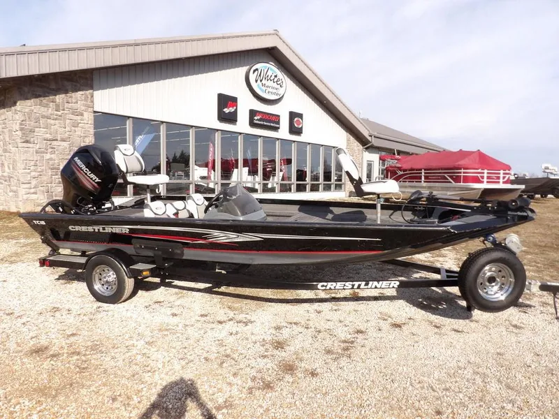 Slide: The Image of 2013 Crestliner TC Series 18 boat on trailer outside dealership. - 46