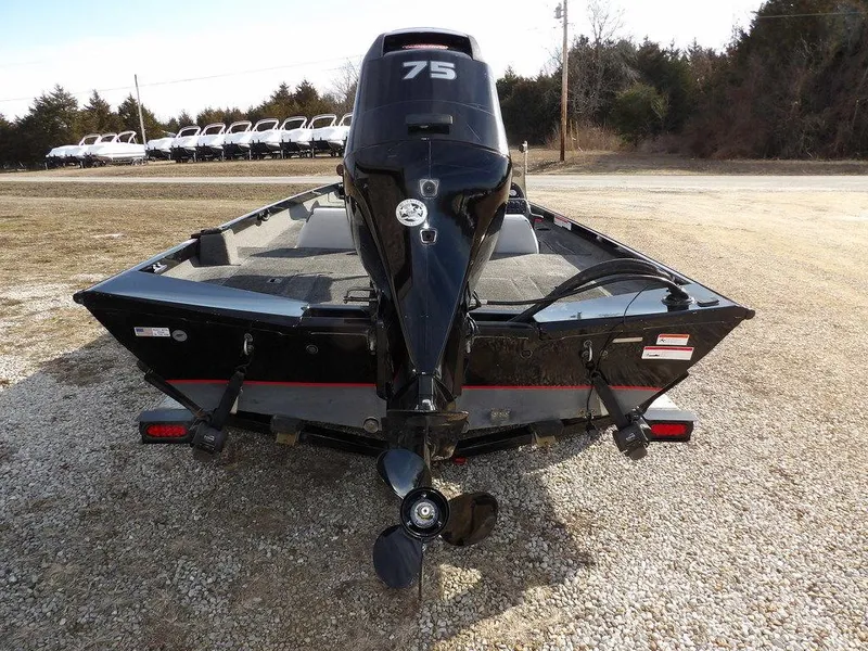 Slide: The Image of 2013 Crestliner TC Series 18 boat with 75 HP motor, parked on gravel. - 6