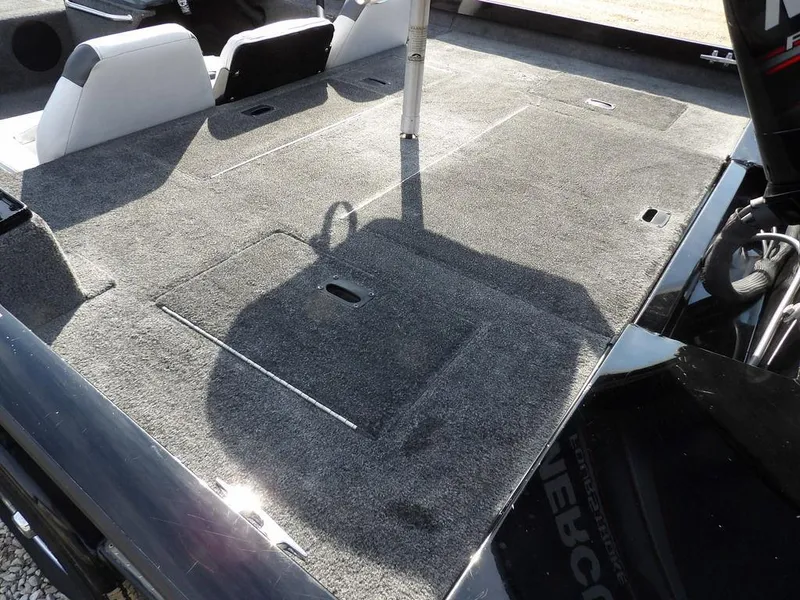 Slide: The Image of 2013 Crestliner TC Series 18 boat interior with carpeted deck and seating. - 7