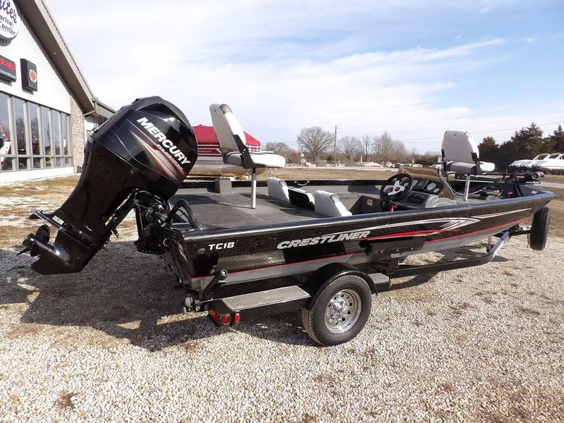 Slide: The Image of 2013 Crestliner TC Series 18 boat with Mercury engine on gravel lot. - 8