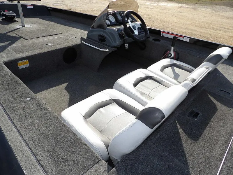 Slide: The Image of 2013 Crestliner TC Series 18 boat interior with dual seats and steering console. - 9