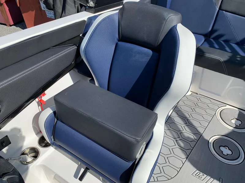 Slide: The Image of 2023 MasterCraft NXT20 boat seat with blue and black upholstery, featuring modern design and comfort. - 16