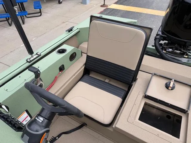 Slide: The Image of 2025 SeaArk Easy 200 boat interior with steering wheel and seating. - 14