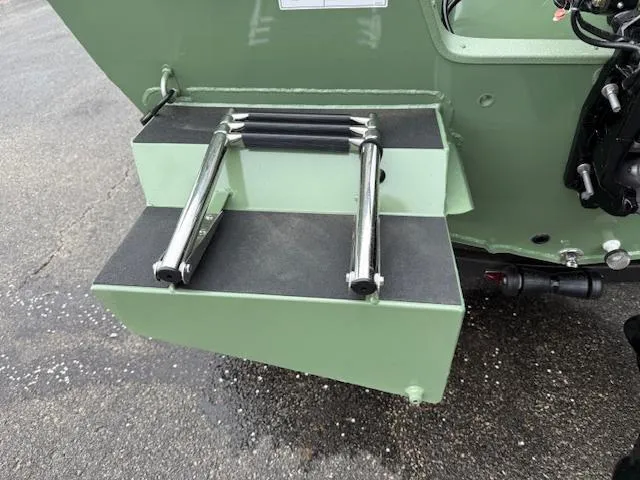 Slide: The Image of 2025 SeaArk Easy 200 boat ladder with Suzuki DF200 engine, green finish. - 3