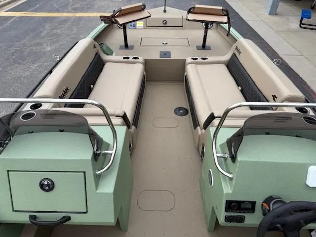 Slide: The Image of 2025 SeaArk Easy 200 boat interior with seating and storage, featuring a Suzuki DF200 engine. - 4